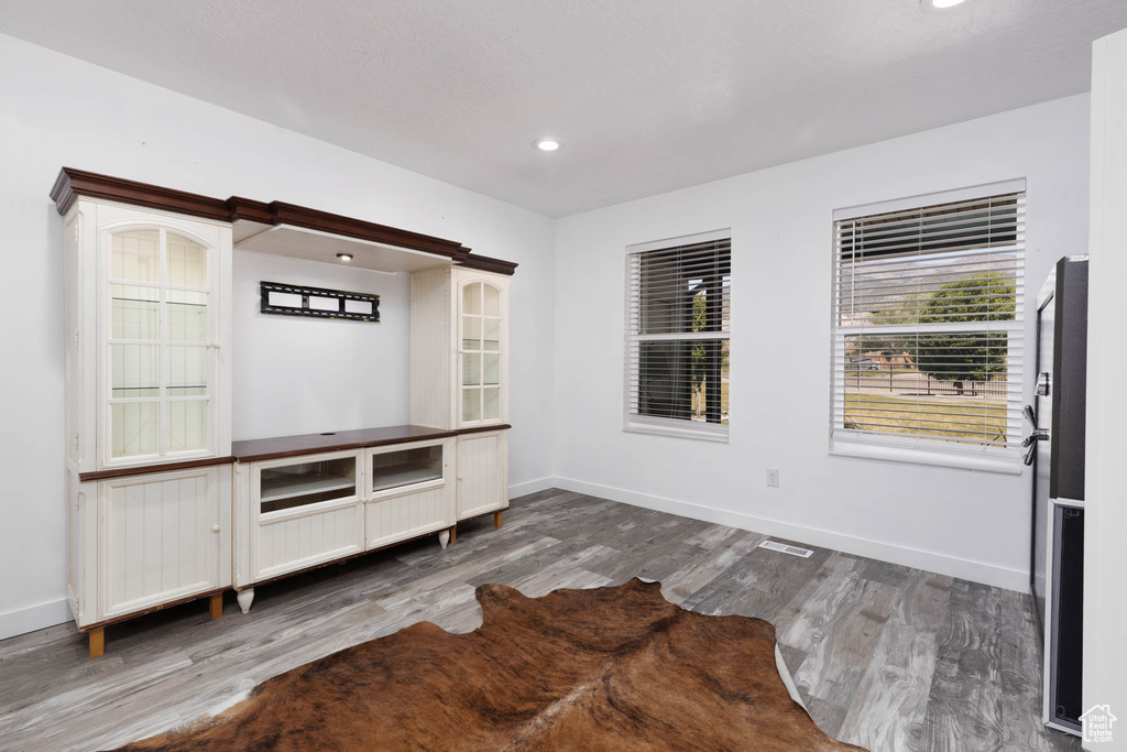 Mudroom featuring wood finished floors, baseboards, and recessed lighting