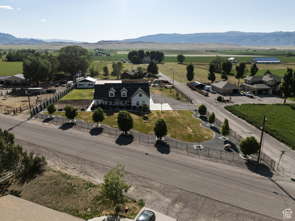 Aerial view of sparsely populated area with a mountainous background