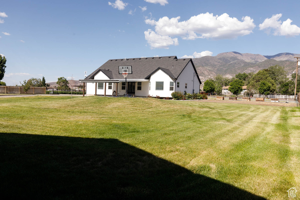 Back of house featuring a mountain view
