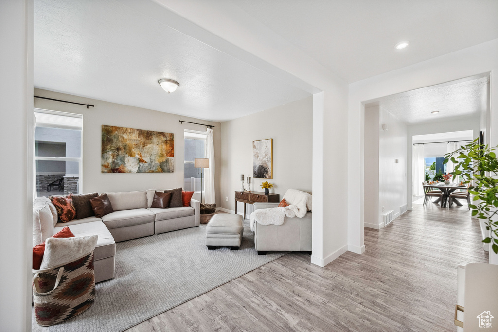Living area featuring wood finished floors and baseboards
