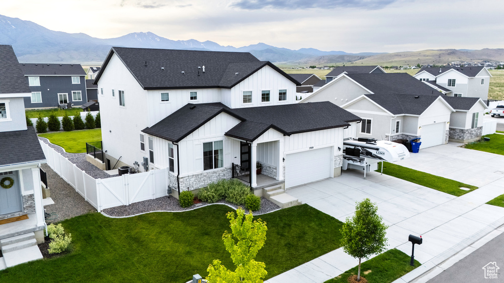 Aerial perspective of suburban area with a mountainous background
