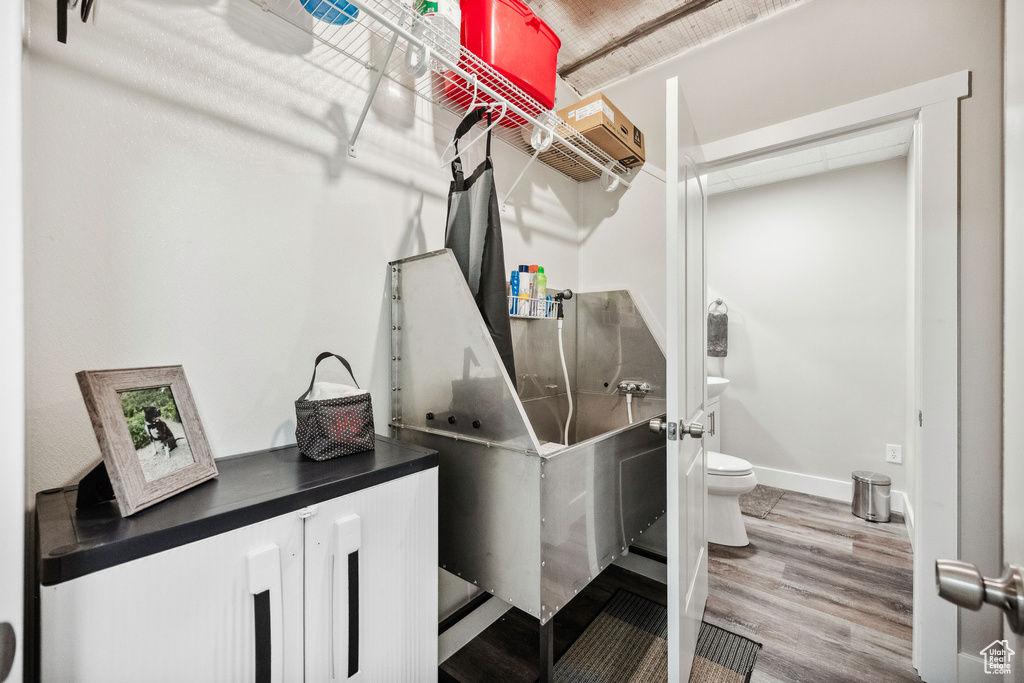 Miscellaneous room featuring wood finished floors and baseboards