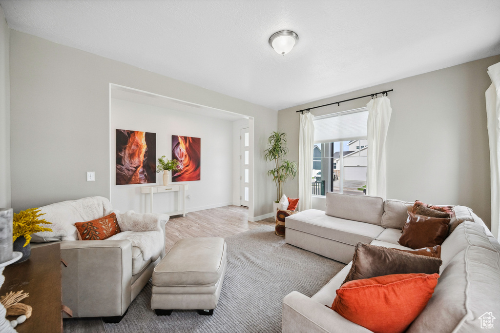 Living room featuring baseboards and wood finished floors