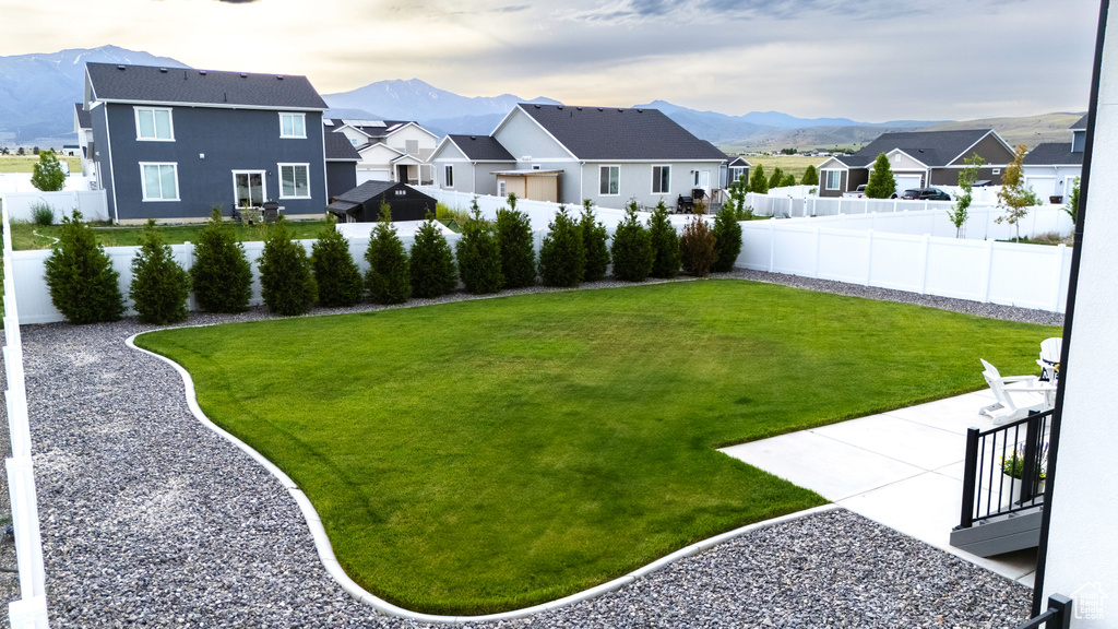 View of yard featuring a mountain view and a residential view