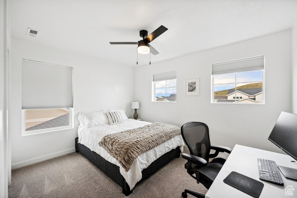 Bedroom featuring baseboards, a desk, carpet floors, and ceiling fan