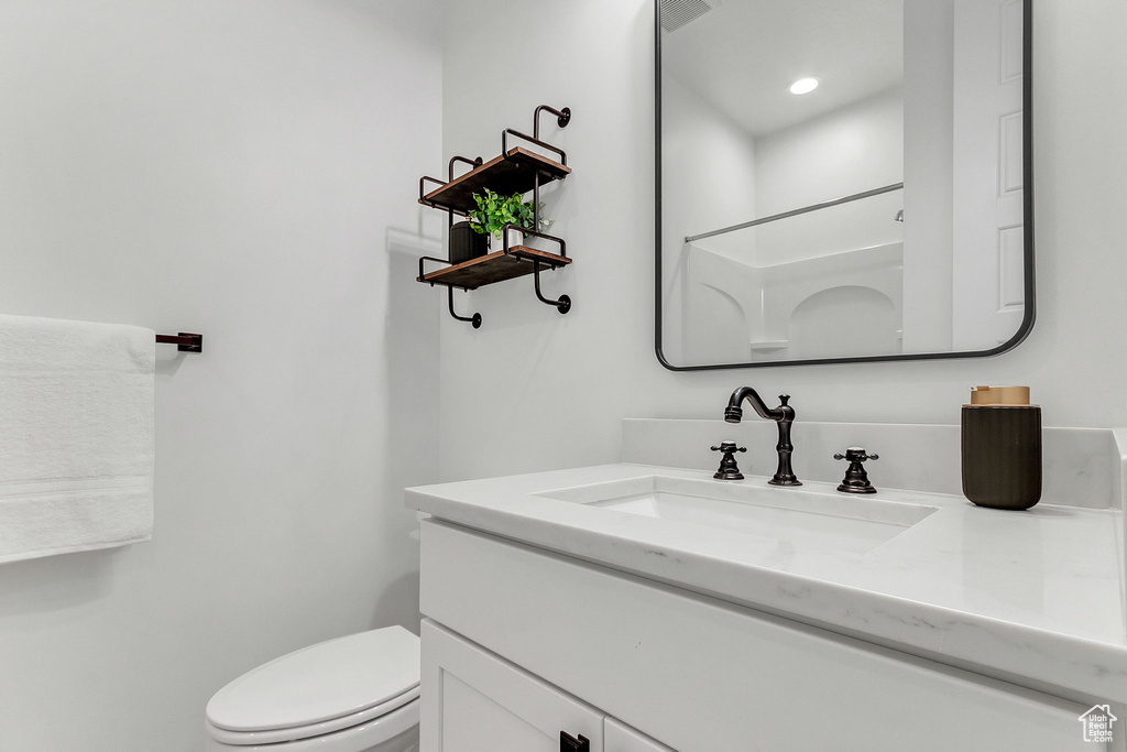 Bathroom with vanity and toilet