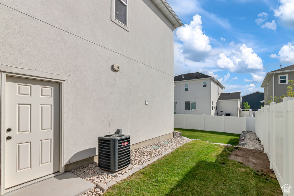 View of yard with central AC unit