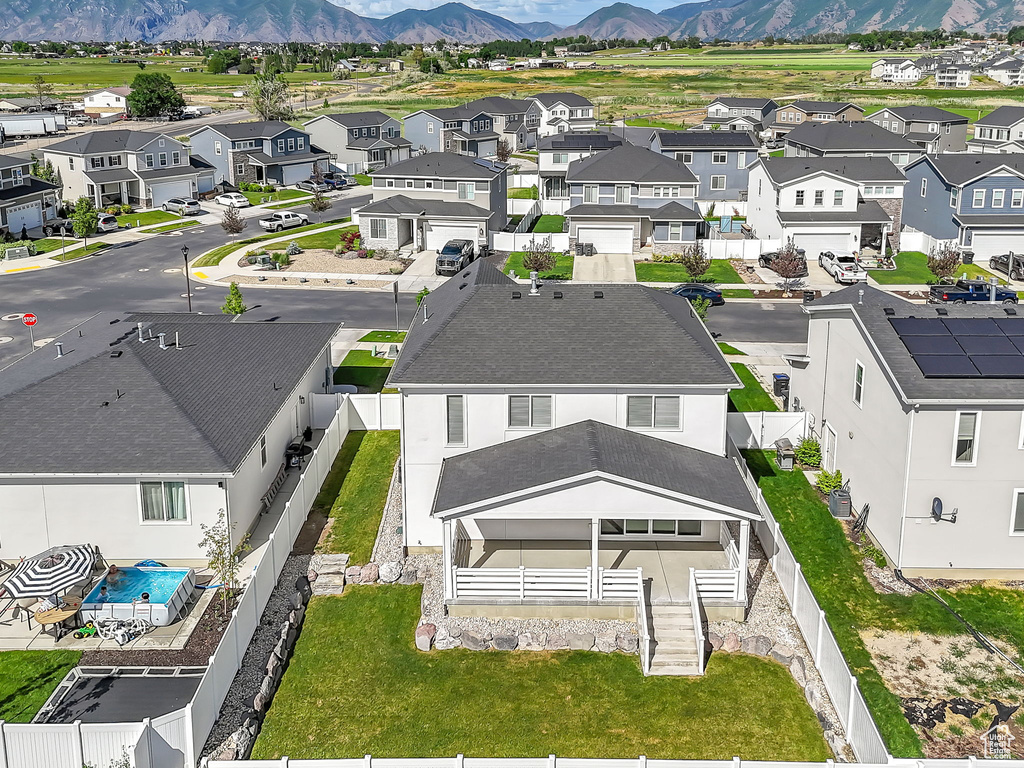 Aerial view of residential area with a mountainous background