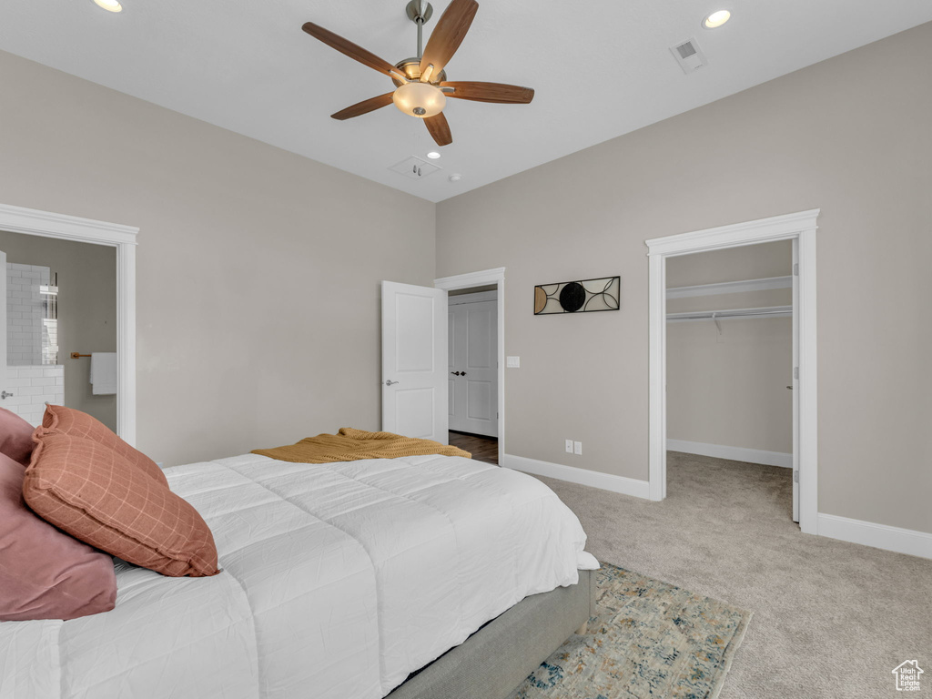 Bedroom with carpet, recessed lighting, baseboards, a spacious closet, and ceiling fan