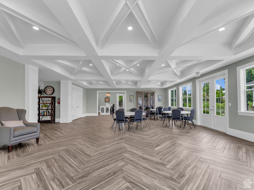 Sunroom featuring french doors, coffered ceiling, and beamed ceiling
