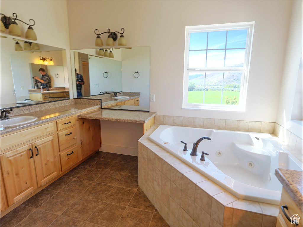 Full bath with a tub with jets and vanity