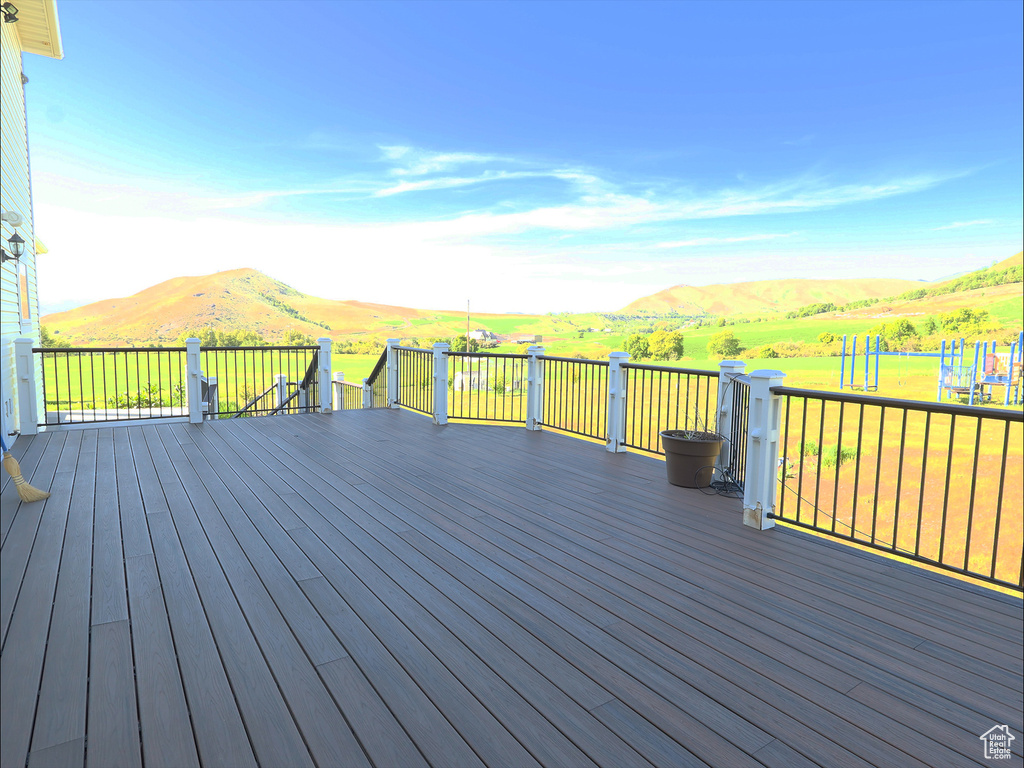 Wooden terrace featuring a mountain view
