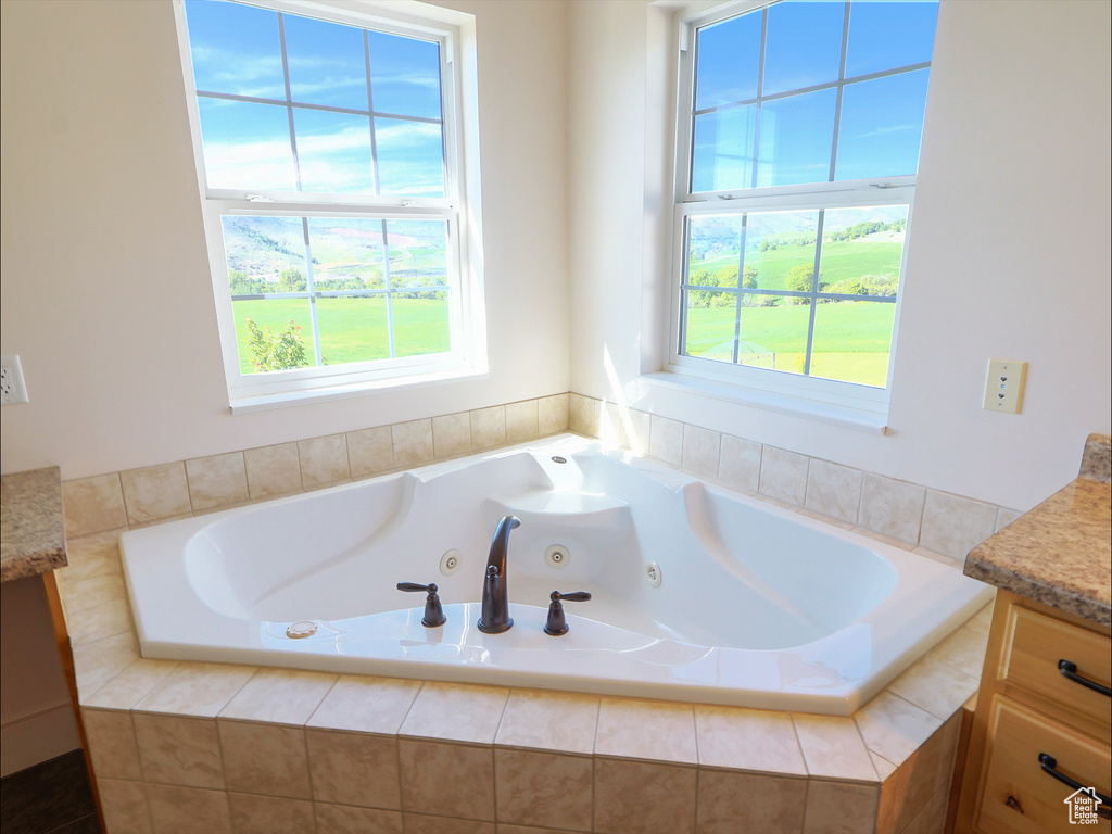 Bathroom featuring vanity and a whirlpool tub
