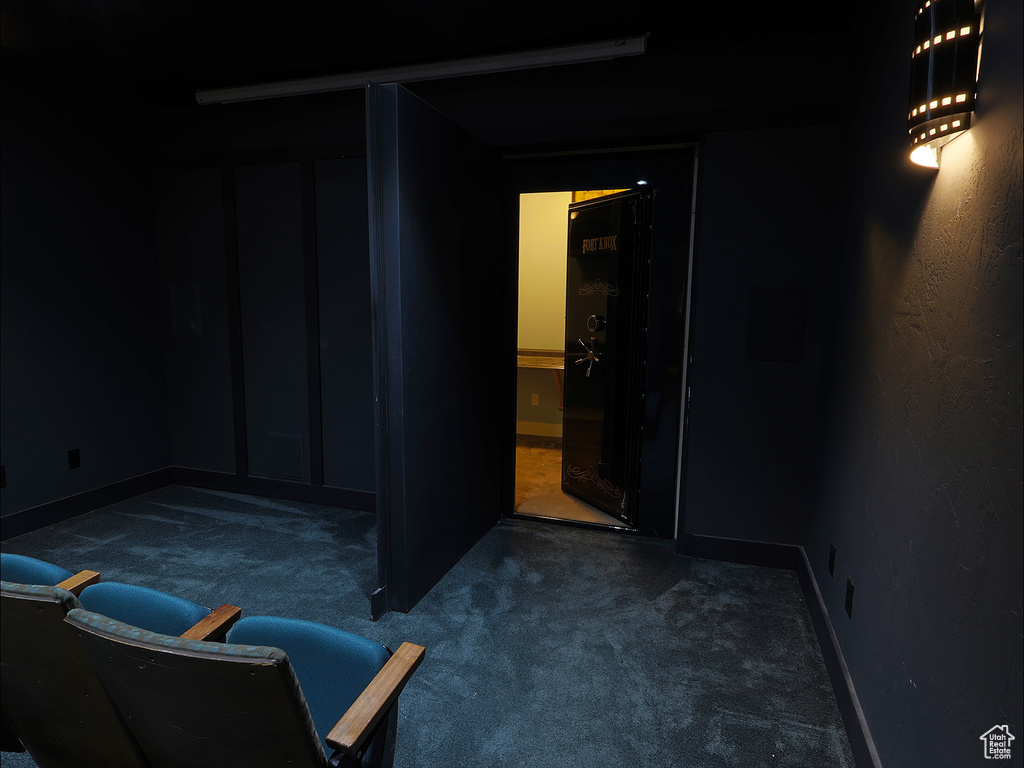 Below grade area with carpet flooring and baseboards