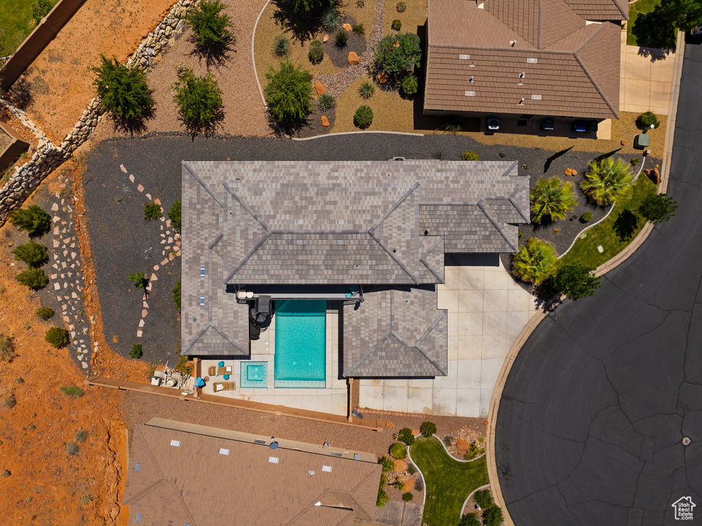 View of subject property featuring a pool