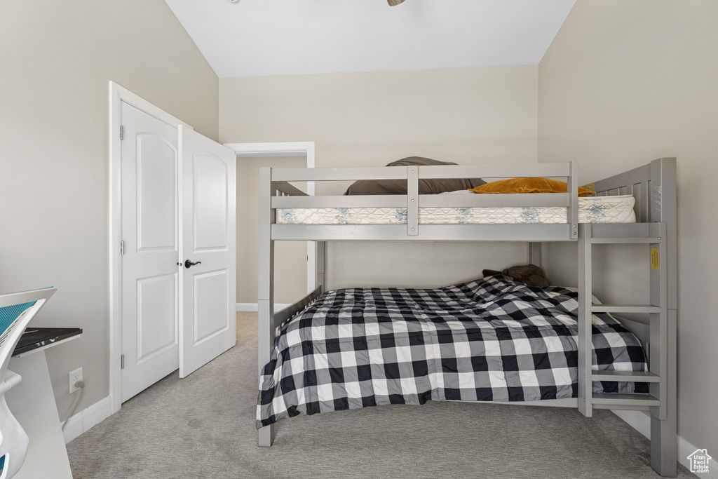 Carpeted bedroom with baseboards