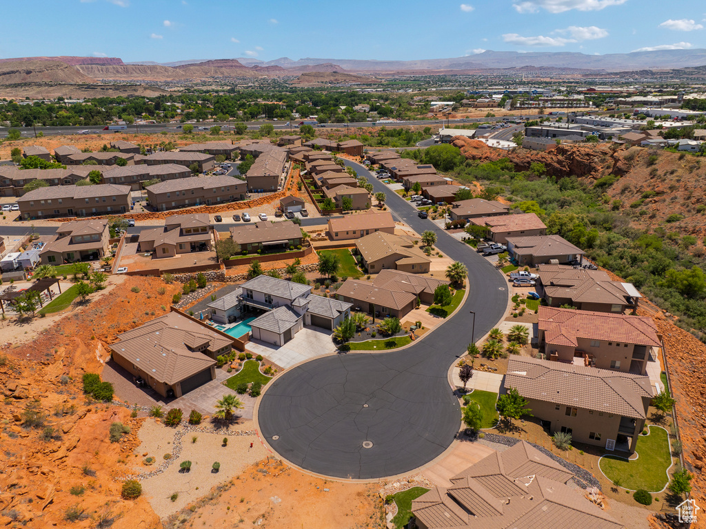 Aerial perspective of suburban area with a mountainous background