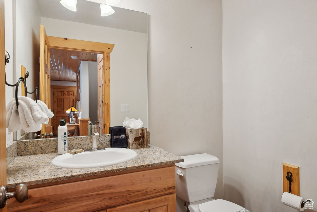 Bathroom with vanity and toilet