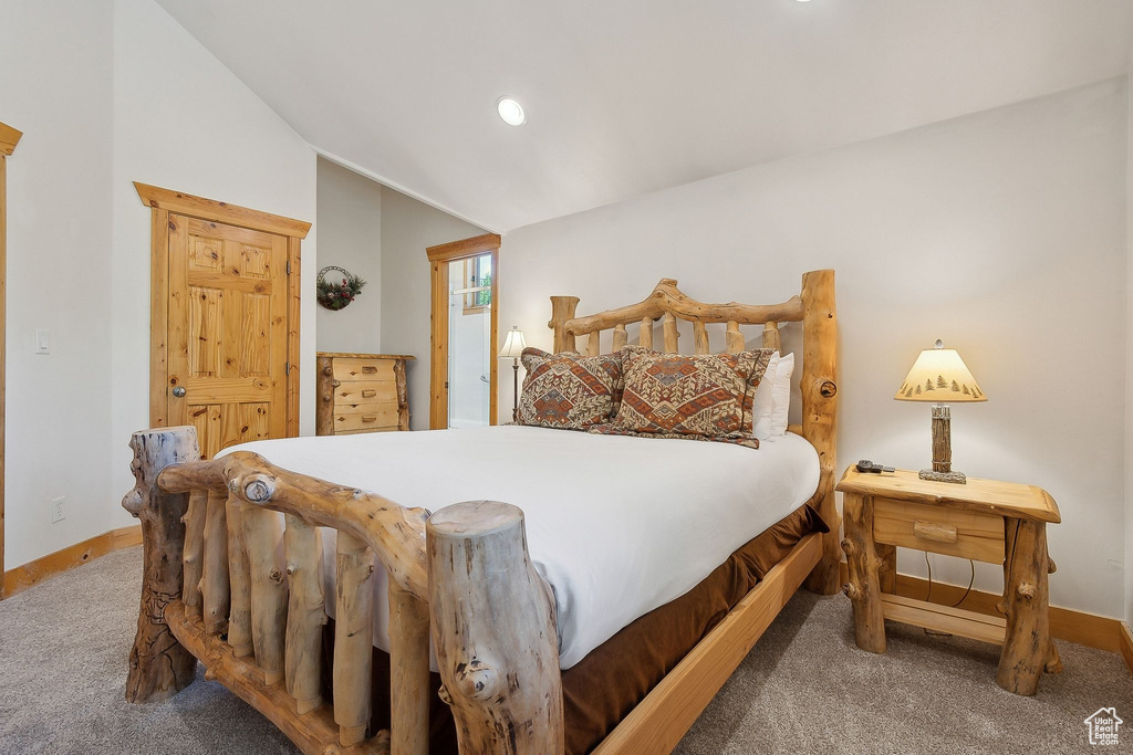 Carpeted bedroom featuring lofted ceiling, baseboards, and recessed lighting