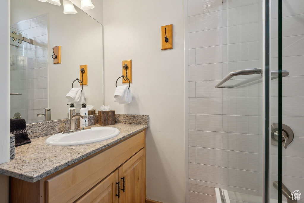 Full bathroom featuring vanity and a stall shower
