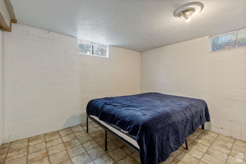 Bedroom featuring a textured ceiling