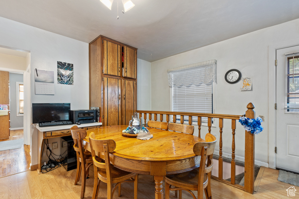 Dining room with light wood finished floors and baseboards