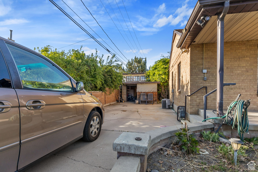 View of home\\\\\\\'s exterior featuring central AC and brick siding