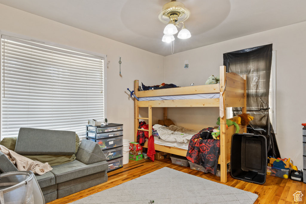 Bedroom with wood finished floors and ceiling fan