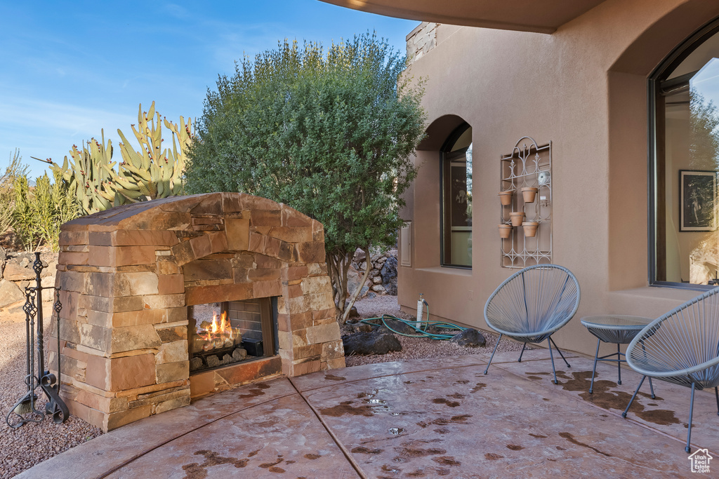 View of patio / terrace with an outdoor stone fireplace