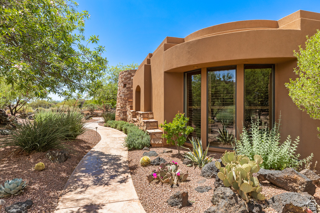 Entrance to property with stucco siding