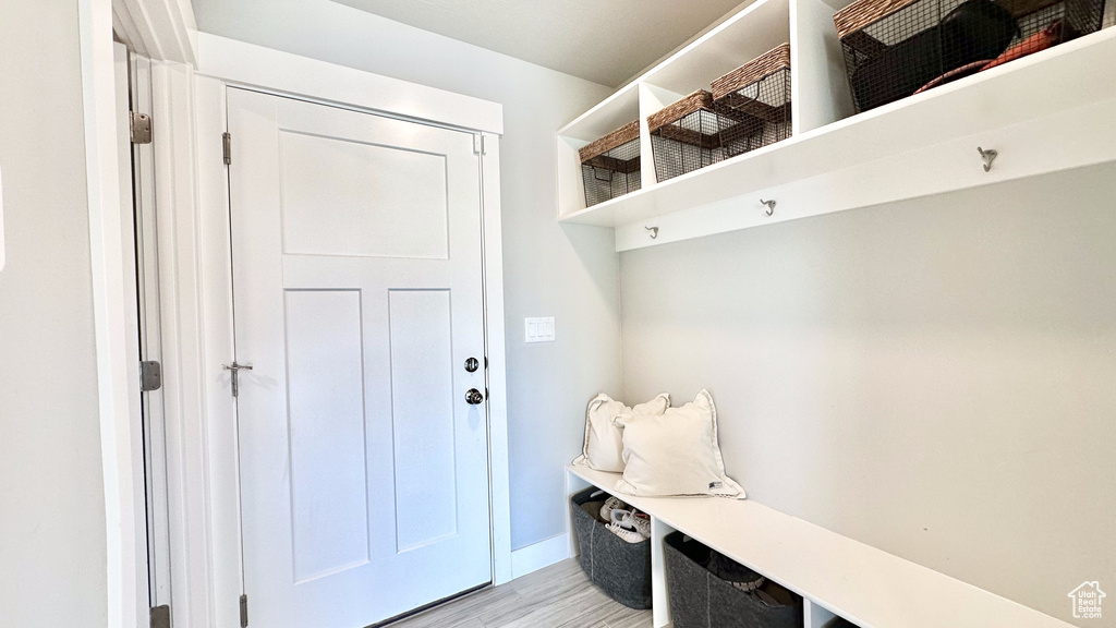 Mudroom featuring light wood finished floors