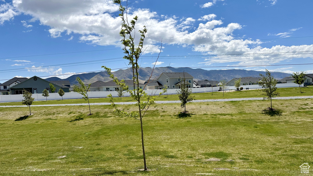 View of mountain backdrop featuring nearby suburban area