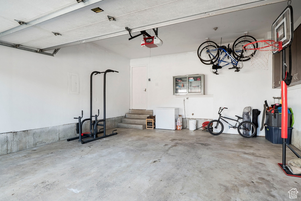 Garage with a garage door opener and electric panel