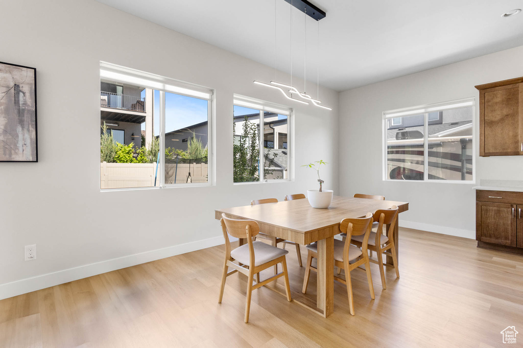 Dining space featuring light wood finished floors and baseboards