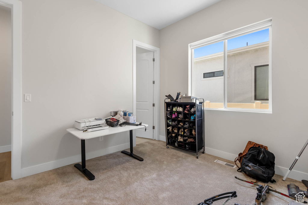 Office space featuring carpet floors and baseboards