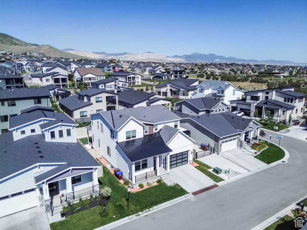 Aerial perspective of suburban area with a mountainous background