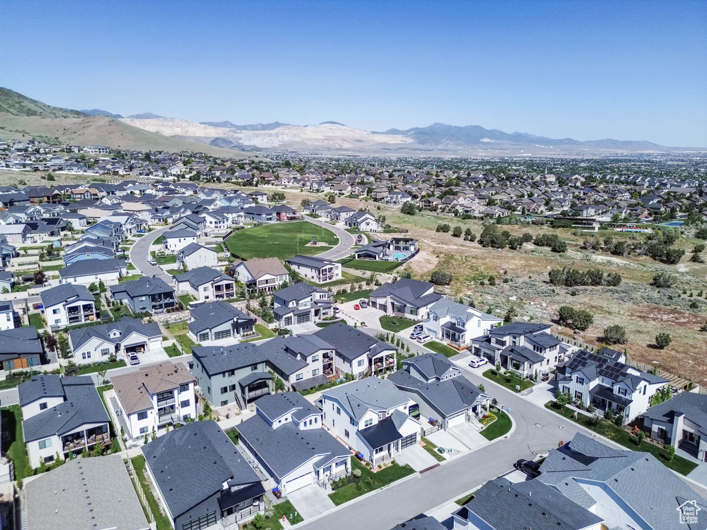 View of property location with mountains and nearby suburban area