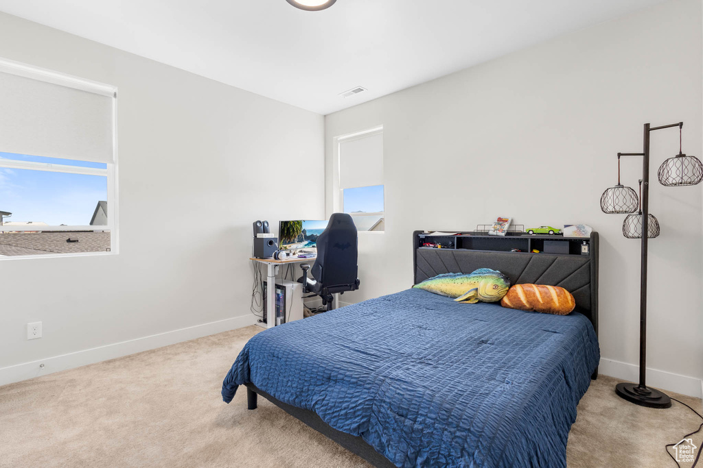 Carpeted bedroom with baseboards