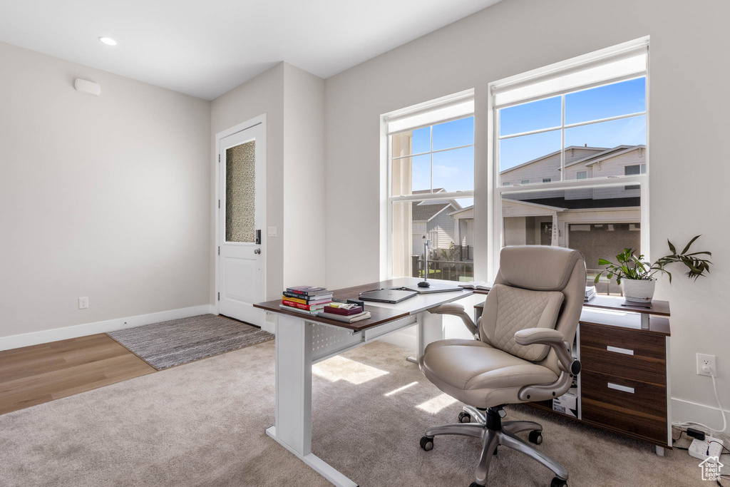 Carpeted office featuring baseboards and recessed lighting