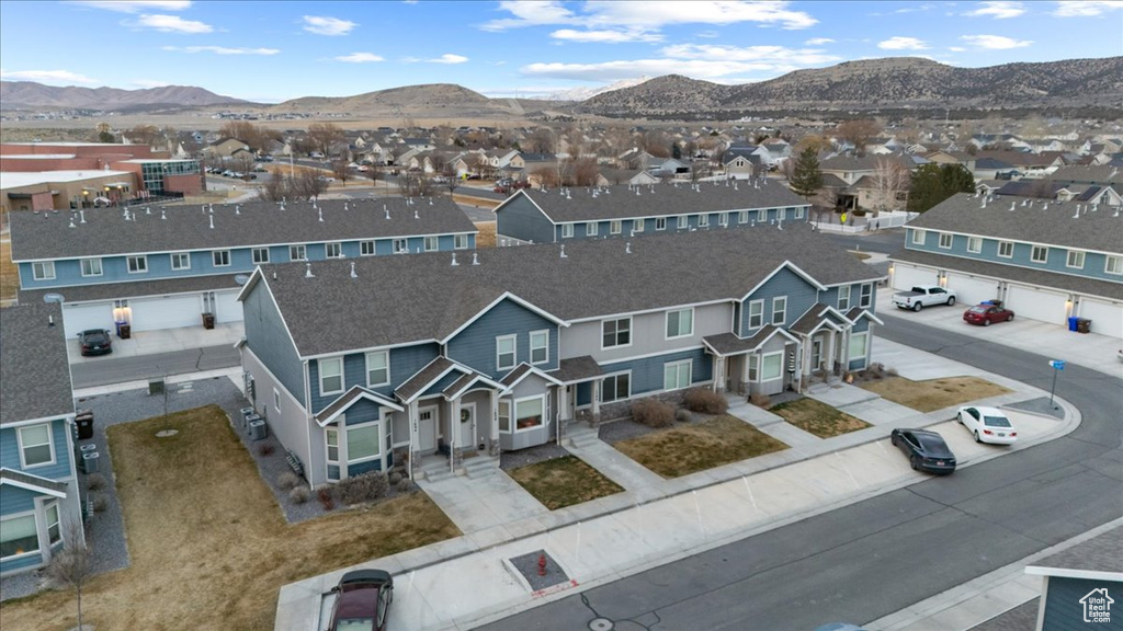 Aerial perspective of suburban area with a mountain backdrop