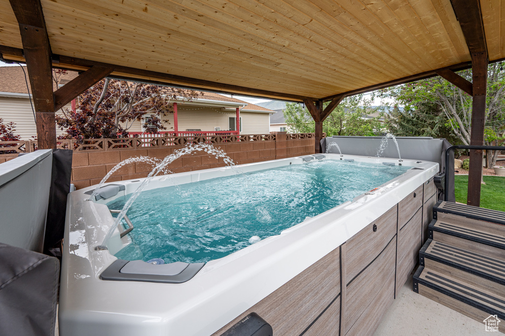 View of swimming pool with a fenced backyard