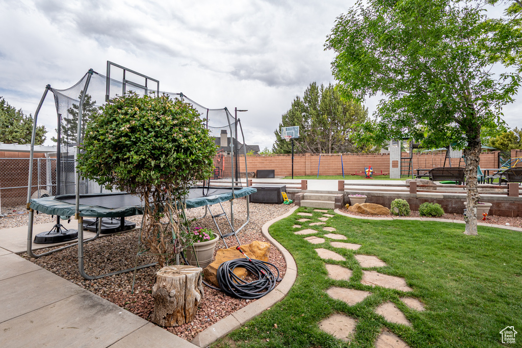 View of yard with a trampoline