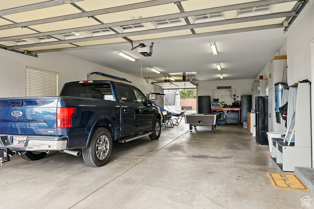 Garage featuring a garage door opener