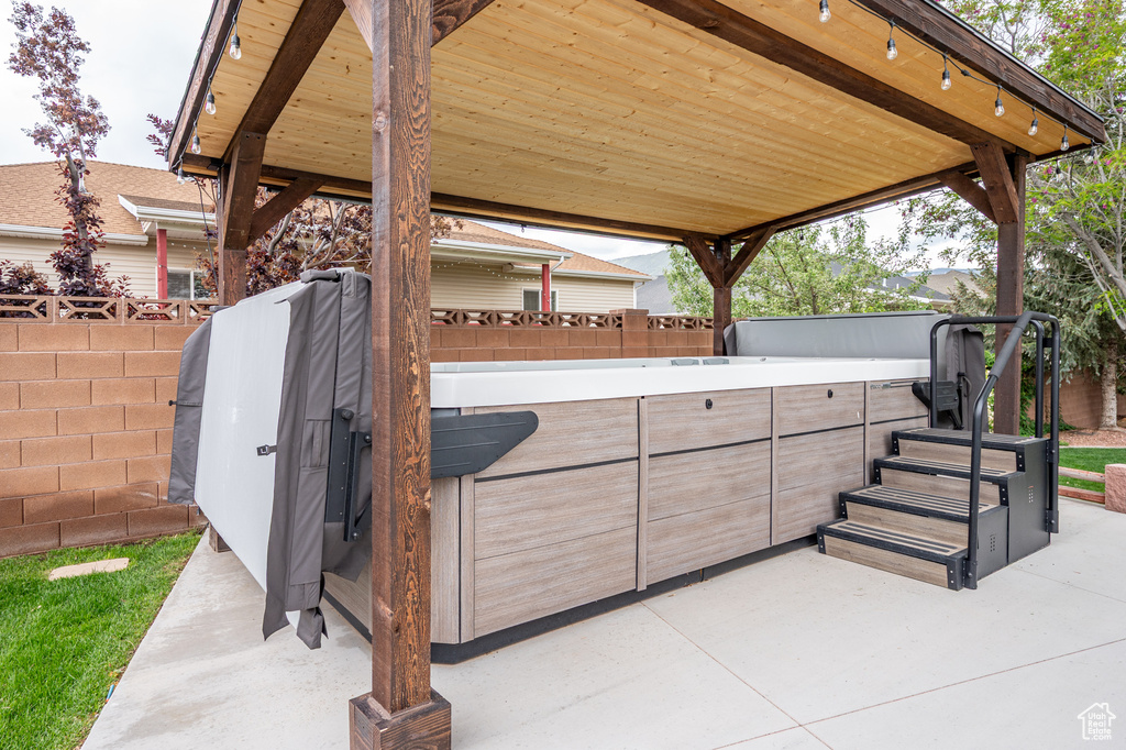 Fenced backyard with a patio