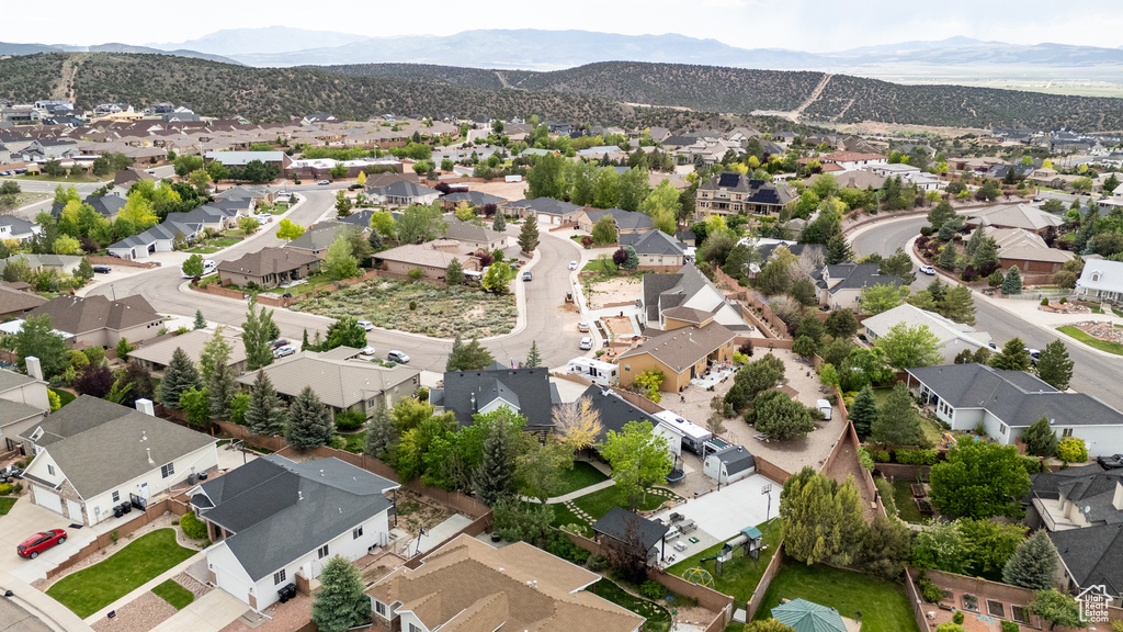 Aerial view of residential area featuring mountains