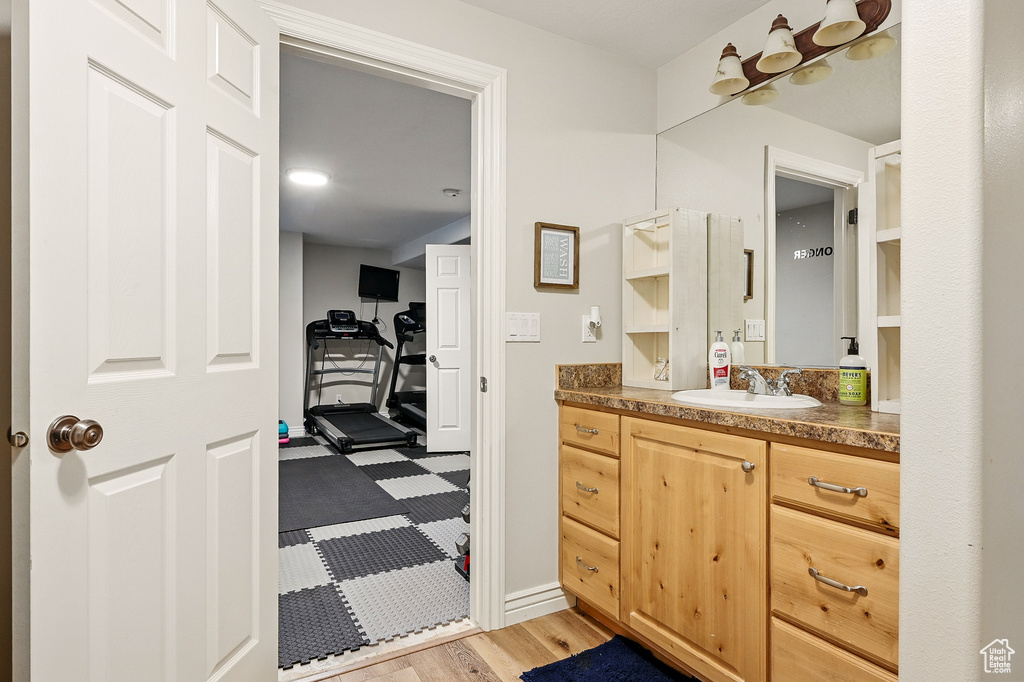 Bathroom with vanity and baseboards