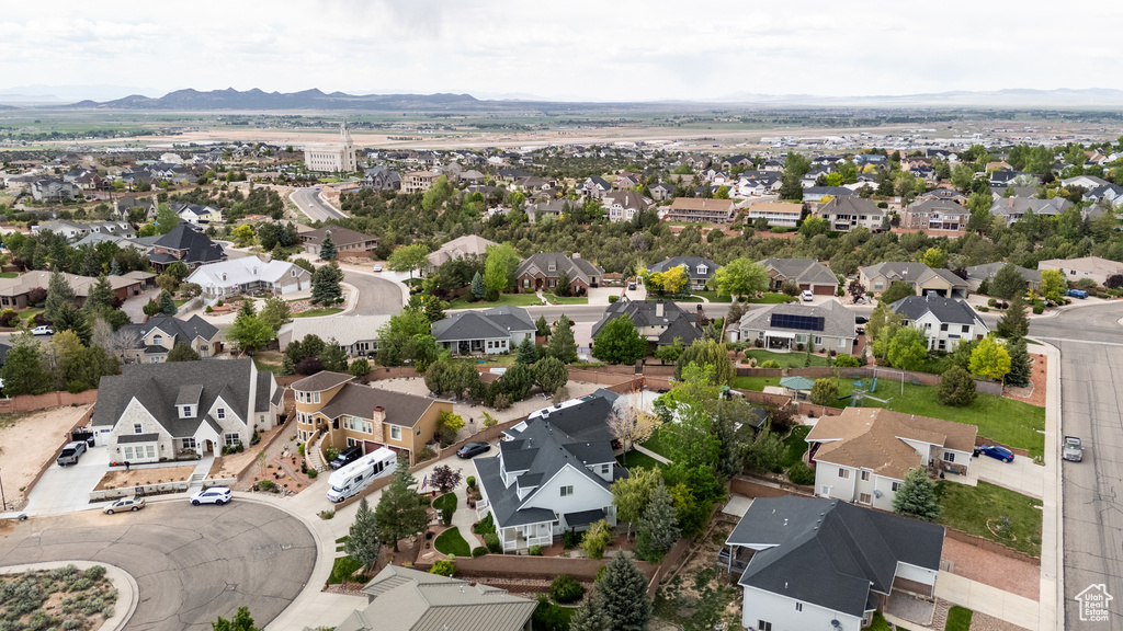 Aerial perspective of suburban area with a mountainous background