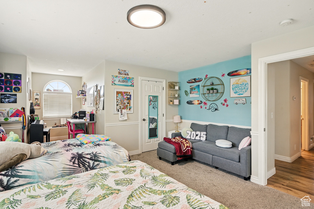 Carpeted bedroom featuring baseboards