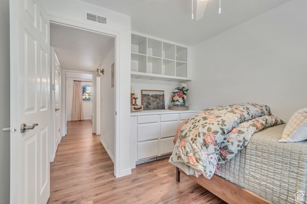 Bedroom featuring light wood-style floors and ceiling fan
