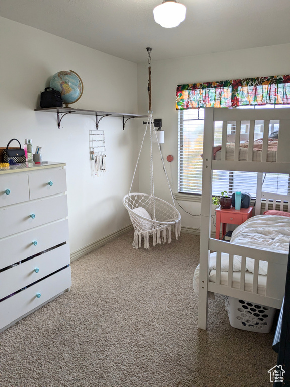 Carpeted bedroom with baseboards